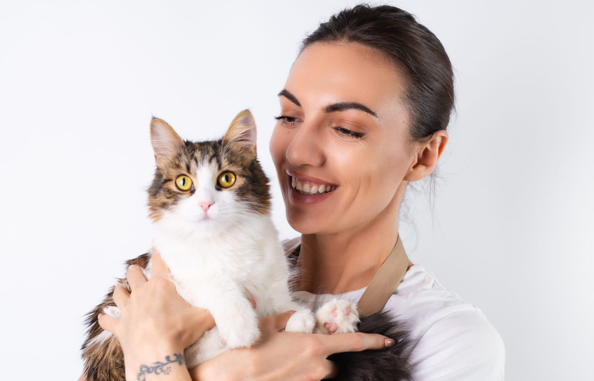 Happy pet owner with her cat using Pet Care Technology App